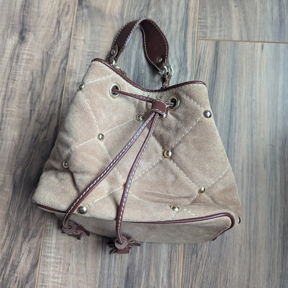 Claudia Firenze Leather Bucket Bag With Pull Top And Tassels.